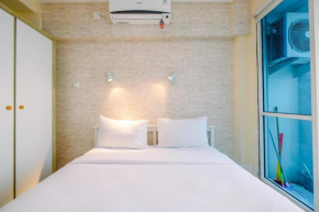 Minimalist Studio with Great City View at Tifolia Apartment By Travelio